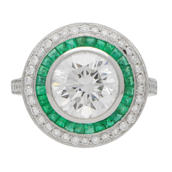 Diamond and emerald double target ring in platinum.