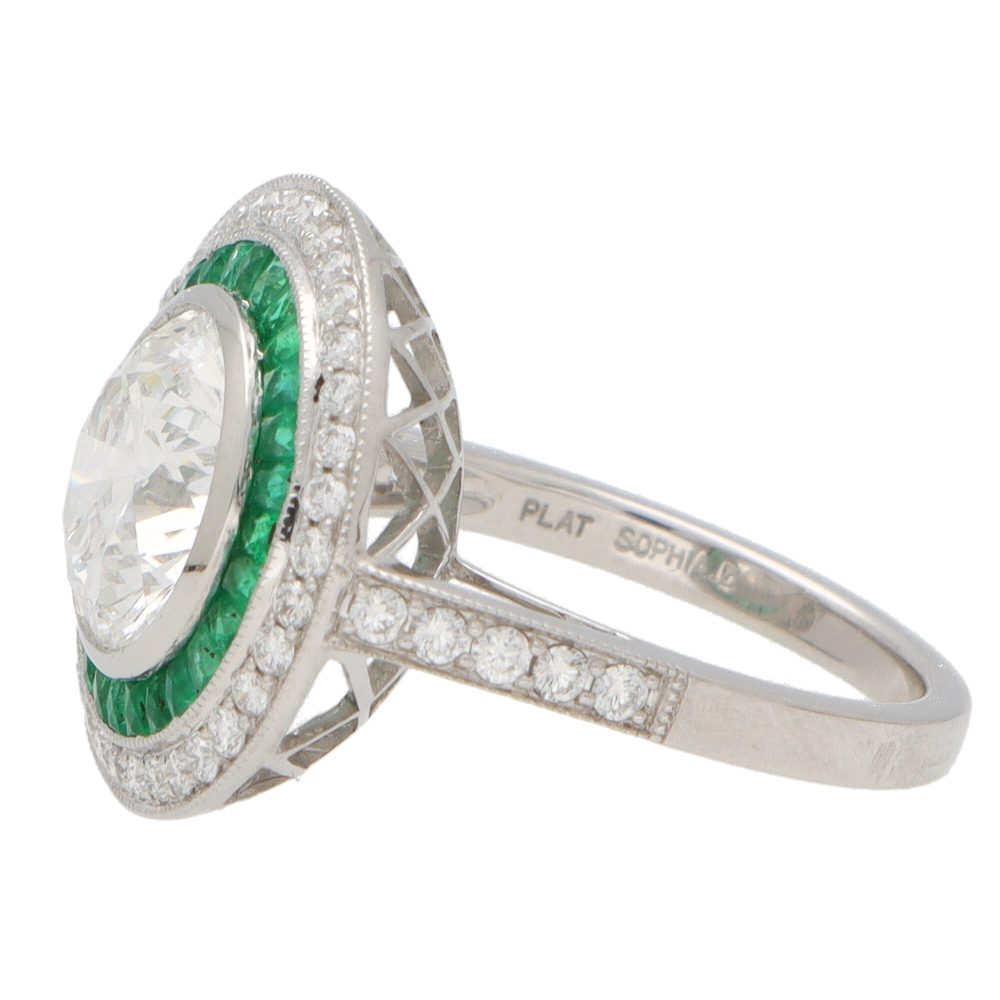 Diamond and emerald double target ring in platinum.