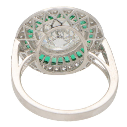 Diamond and emerald double target ring in platinum.
