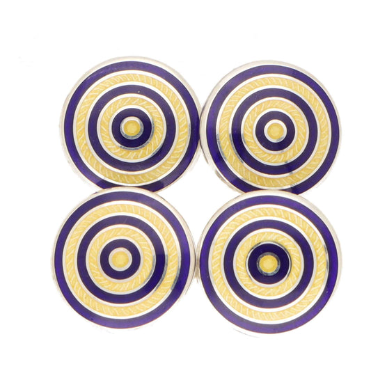 A pair of circular blue and yellow enamel cufflinks in silver, on a white background