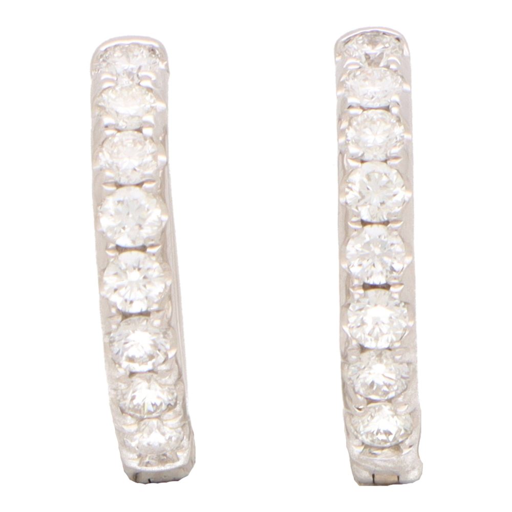 Diamond set hoop earrings in white gold.