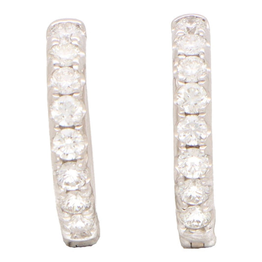 Diamond set hoop earrings in white gold.