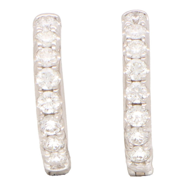 Diamond set hoop earrings in white gold.