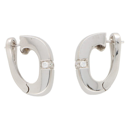 Vintage Mauboussin Paris diamond chunky huggie hoop earrings in white gold.