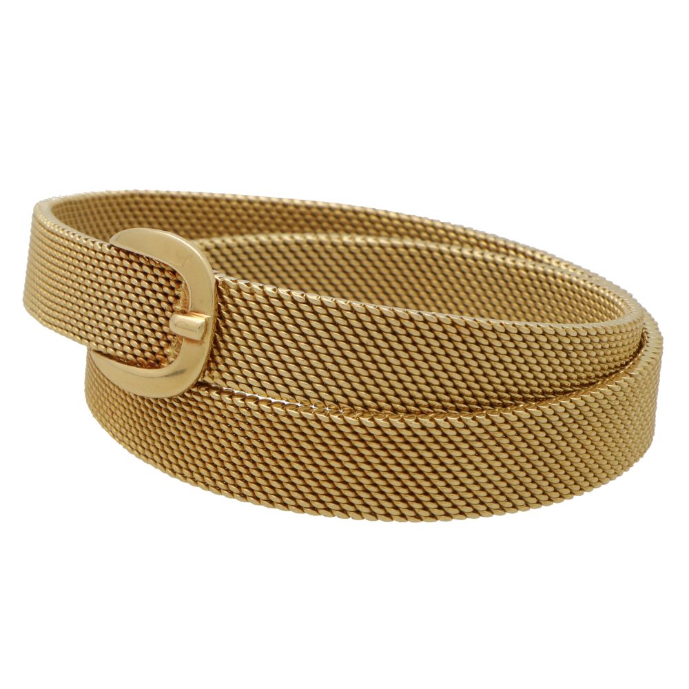 Vintage Hermès belt buckle wrap bracelet set in 18 carat yellow gold.