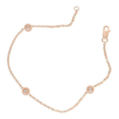 Diamond three stone chain link bracelet in rose gold.