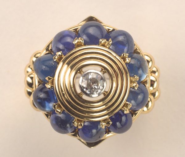Vintage Marchak Sapphire, Diamond and 18ct Gold Dress Ring; ten oval cabochon cut sapphires set around ribbed gold cone which central diamond, Signed, Paris