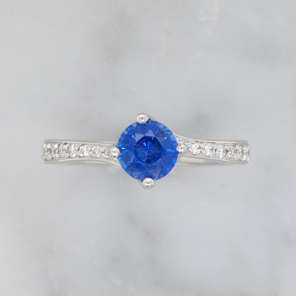 Modern 0.70ct Sapphire and Diamond Twist Setting Ring