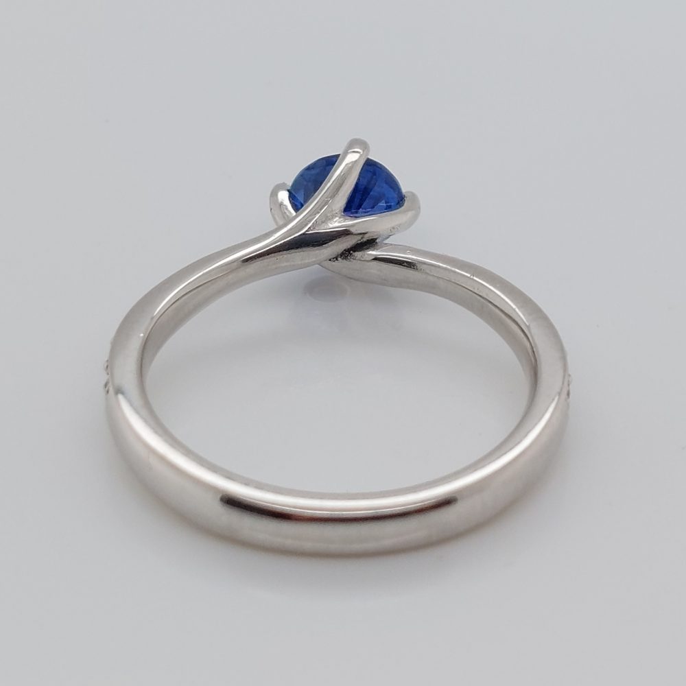 Modern 0.70ct Sapphire and Diamond Twist Setting Ring