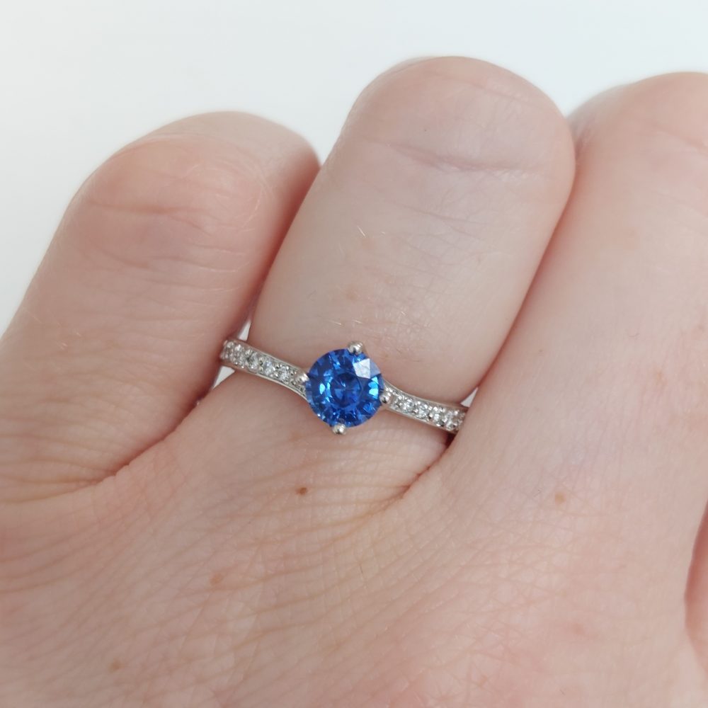 Modern 0.70ct Sapphire and Diamond Twist Setting Ring