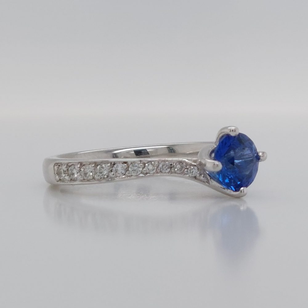 Modern 0.70ct Sapphire and Diamond Twist Setting Ring