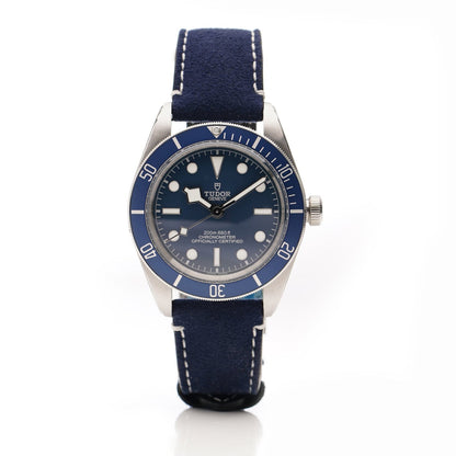 Tudor Geneve Chronometer wristwatch with navy blue dial, bezel and strap on a white background