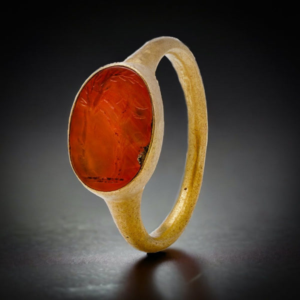 Roman carnelian intaglio ring set in 22 ct yellow gold, circa 100 - 300 AD.
