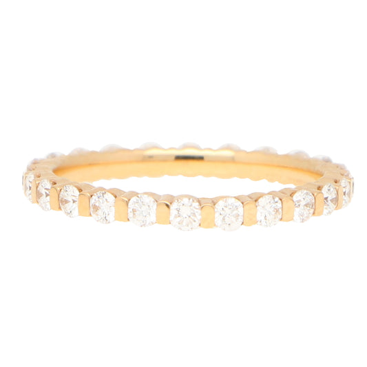 A round diamond full eternity band ring in gold, on a white background