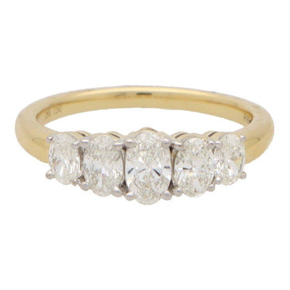 Diamond five stone ring set in yellow and white gold.