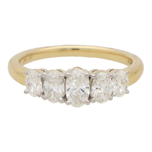 Diamond five stone ring set in yellow and white gold.