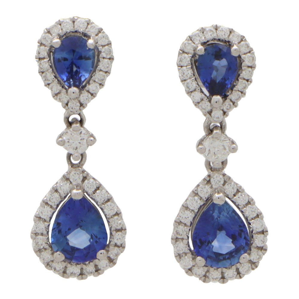 Sapphire and diamond cluster drop earrings in white gold.