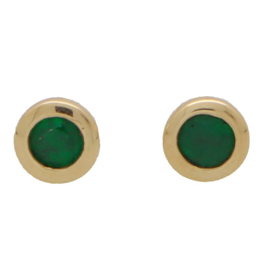 Emerald stud earrings in yellow gold