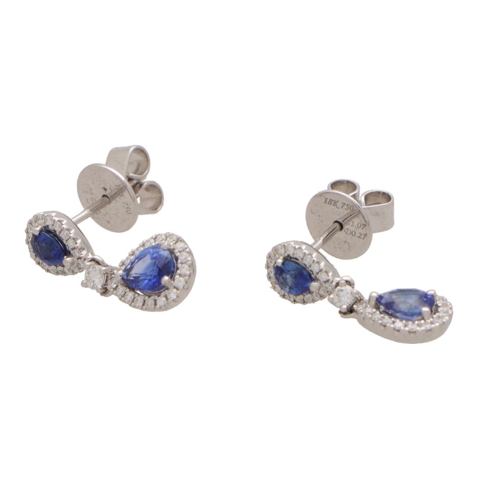 Sapphire and diamond cluster drop earrings in white gold.