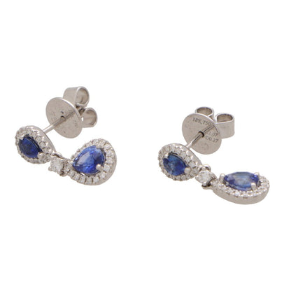 Sapphire and diamond cluster drop earrings in white gold.