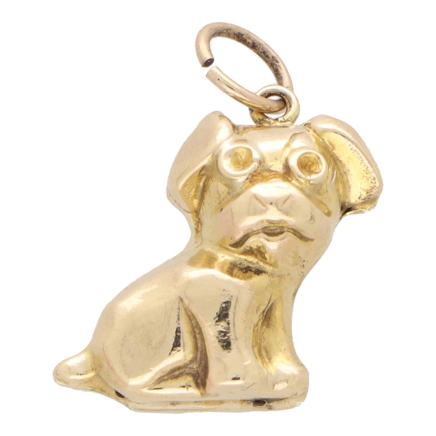 A yellow gold puppy dog charm, on a white background
