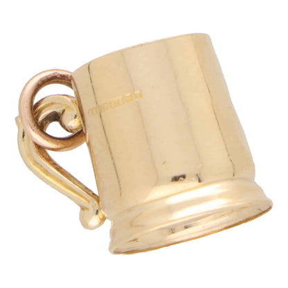 A yellow gold tankard charm, on a white background