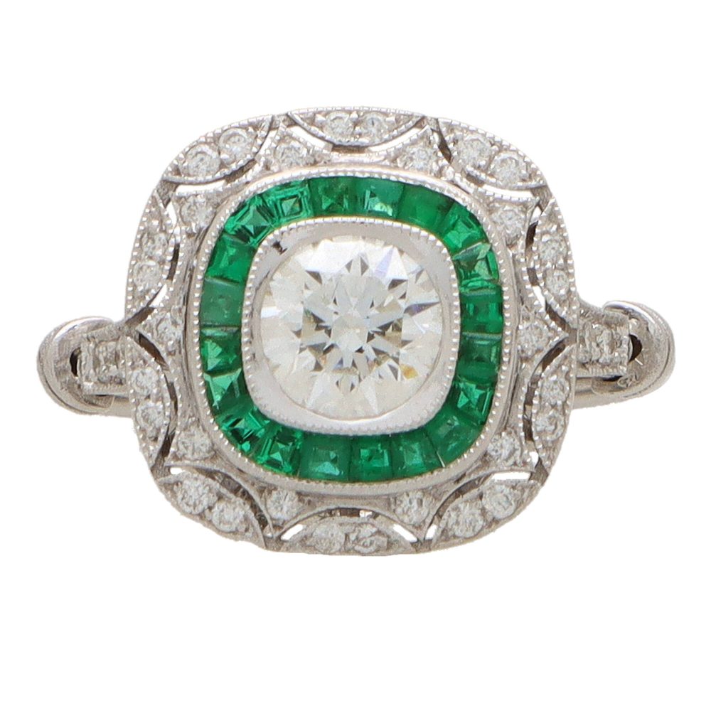 Emerald and diamond double target ring in white gold.