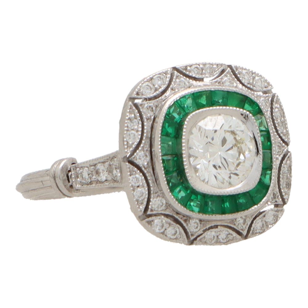 Emerald and diamond double target ring in white gold.