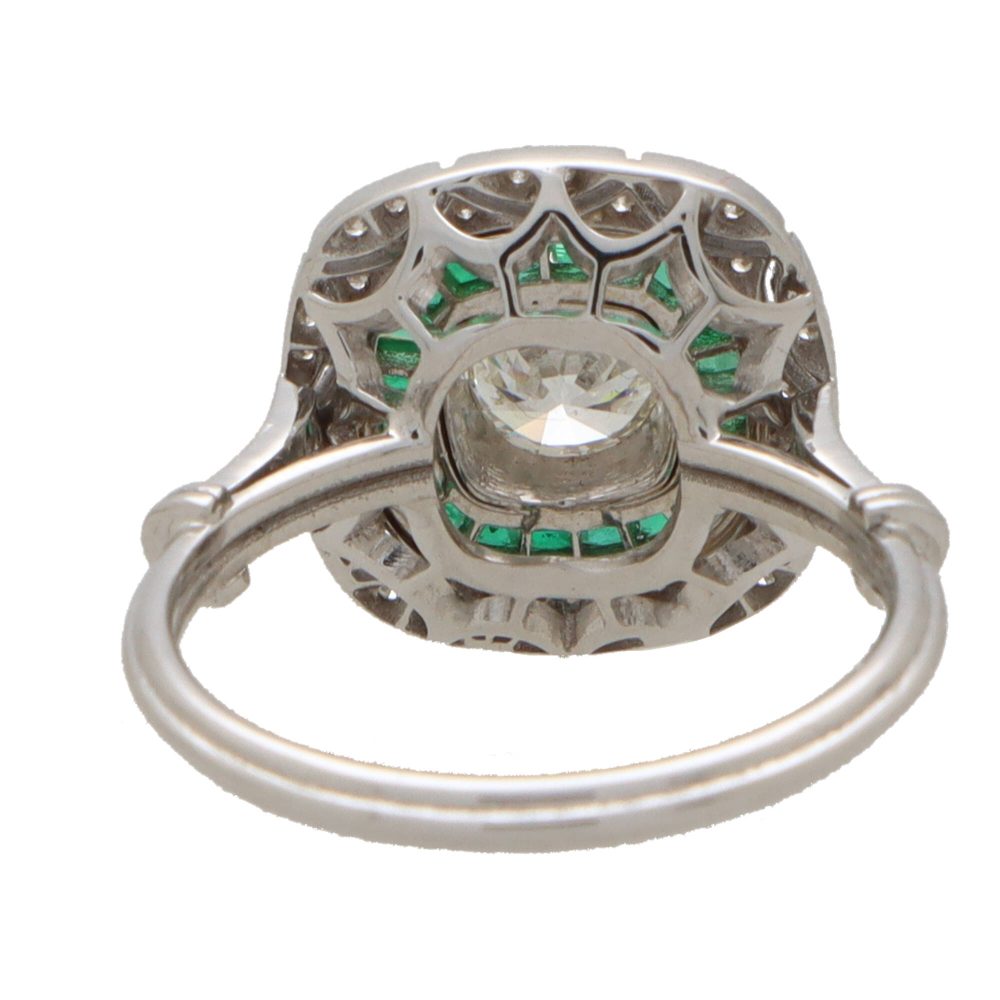 Emerald and diamond double target ring in white gold.