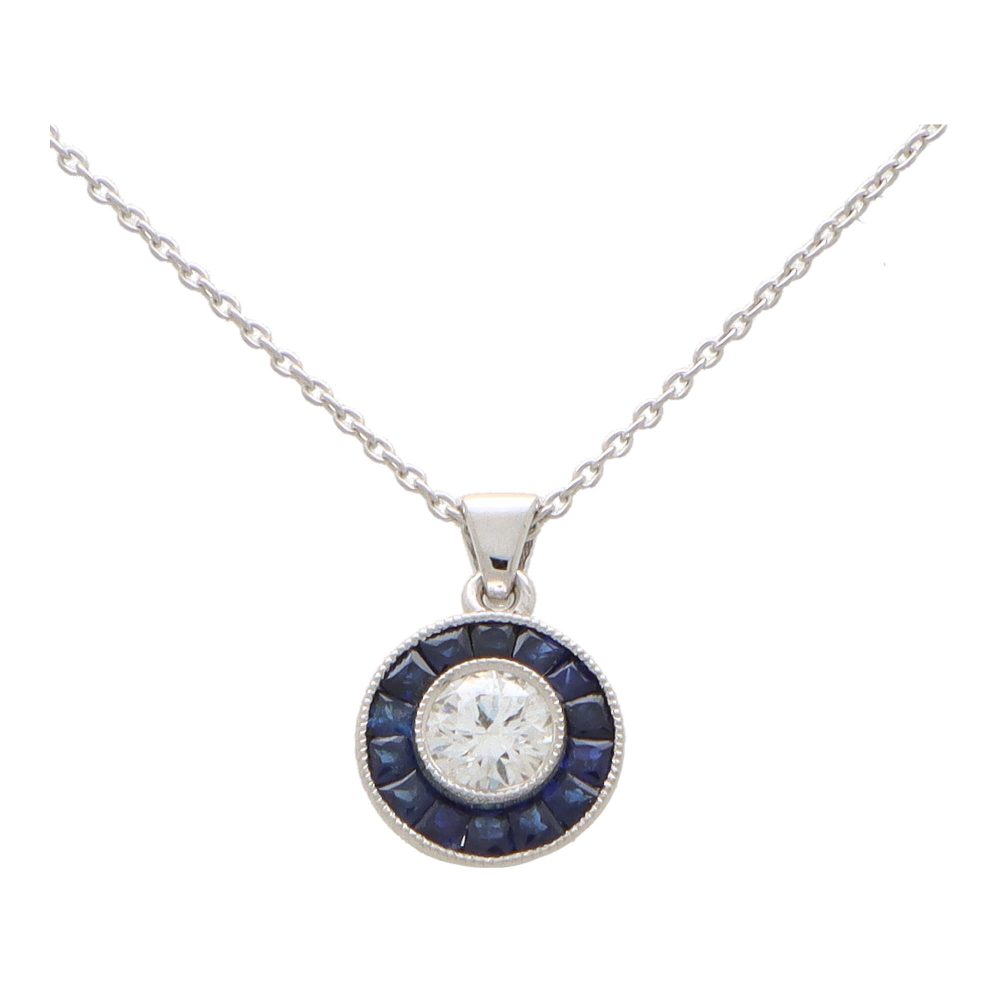 Diamond and sapphire target necklace in white gold.