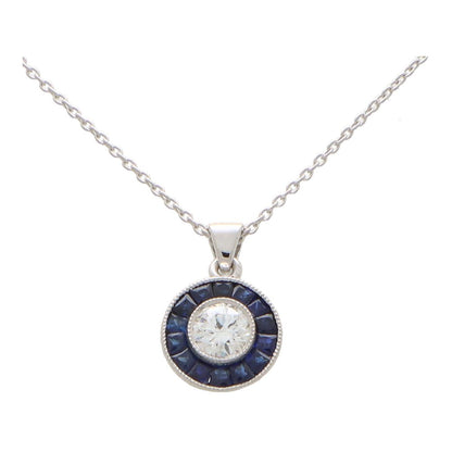 Diamond and sapphire target necklace in white gold.