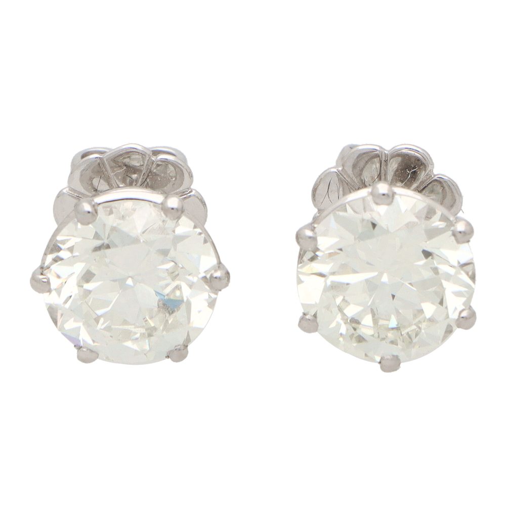 Solitaire certified diamond stud earrings set in gold,