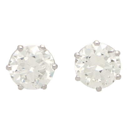 Solitaire certified diamond stud earrings set in gold,