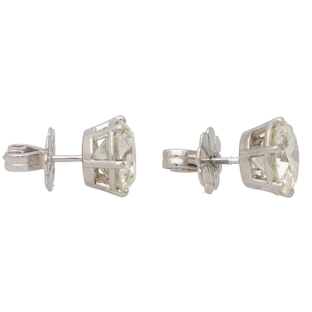 Solitaire certified diamond stud earrings set in gold,