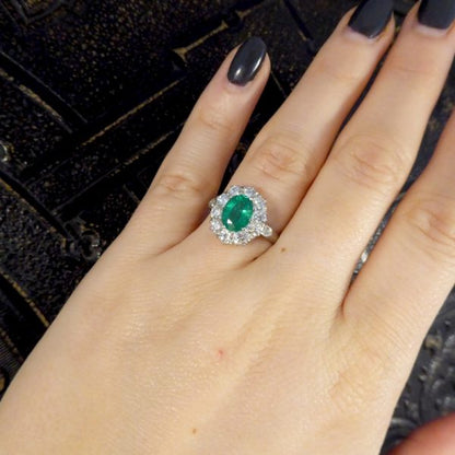 Oval 1.37ct Emerald and 1.00ct Diamond Cluster Ring