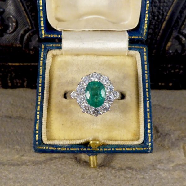 Oval 1.37ct Emerald and 1.00ct Diamond Cluster Ring