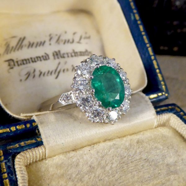 Oval 1.37ct Emerald and 1.00ct Diamond Cluster Ring