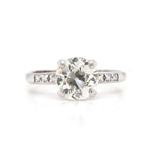Art Deco 1.60ct Diamond Solitaire Engagement Ring; featuring a single sparkling round cut diamond in a tulip setting, diamond set shoulders, in platinum