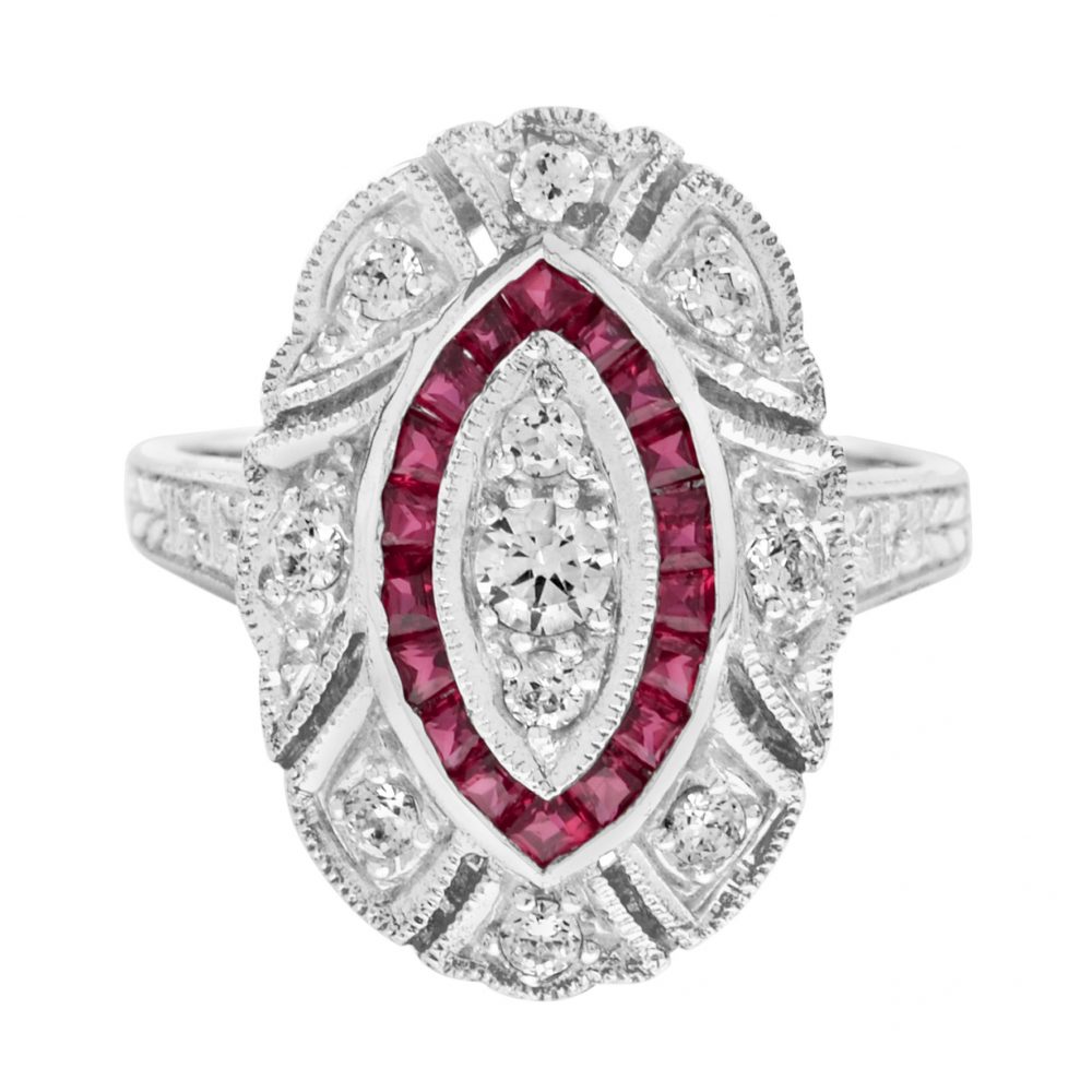 Art Deco Style Diamond and Ruby Navette Cluster Cocktail Ring; featuring three vertically set diamonds within a navette-shaped French cut natural ruby border and an outer surround of brilliant-cut diamonds in 18ct white gold