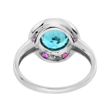 2.75ct Blue Zircon Ring with Ruby and Diamond Halo Cluster, central round-cut blue zircon is surrounded by rubies with a deep pink hue and diamonds with diamond-set shoulders in 14ct white gold
