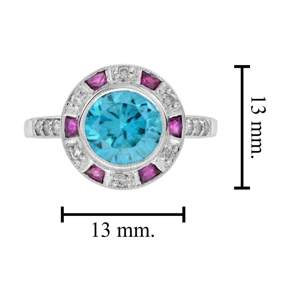 2.75ct Blue Zircon Ring with Ruby and Diamond Halo Cluster, central round-cut blue zircon is surrounded by rubies with a deep pink hue and diamonds with diamond-set shoulders in 14ct white gold