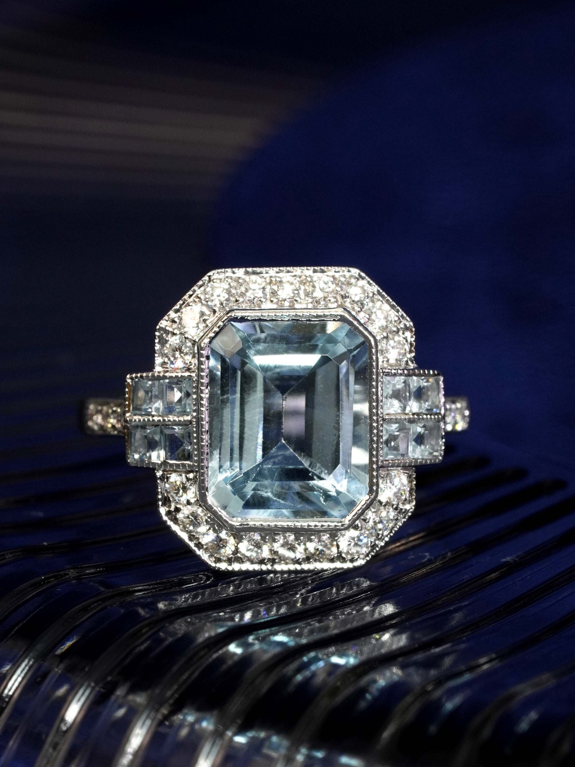 2.90ct Emerald Cut Aquamarine and Diamond Cluster Engagement Ring in 14ct Gold