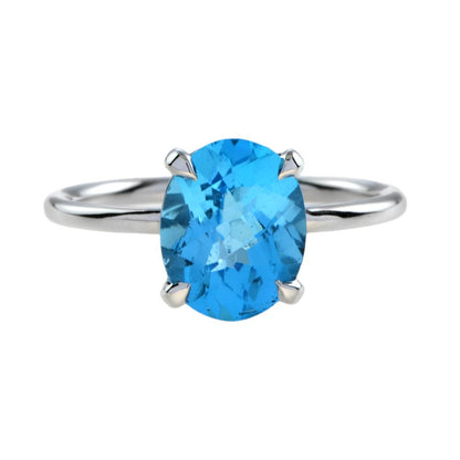 3.50ct Oval Swiss Blue Topaz Solitaire Engagement Ring; 3.50 carat oval blue topaz four-claw set and mounted to a plain 9ct white gold band