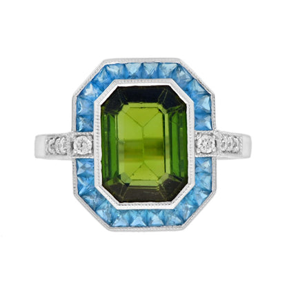 3.41ct Emerald Cut Green Tourmaline and Blue Topaz Cluster Ring with Diamond Shoulders in 14ct white gold with diamond shoulders