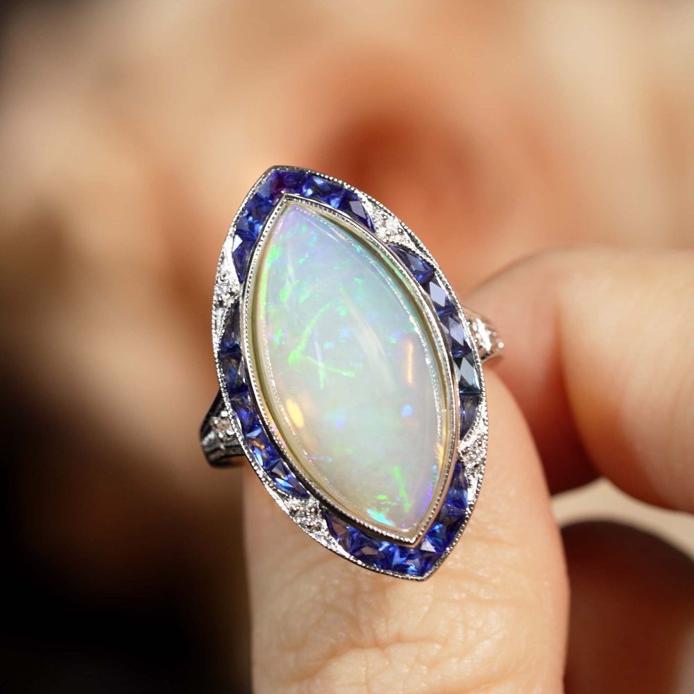 6.55ct Marquise Opal with Sapphire and Diamond Cluster Navette Ring