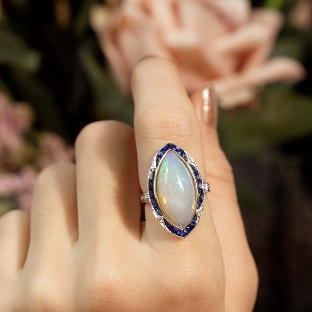 6.55ct Marquise Opal with Sapphire and Diamond Cluster Navette Ring