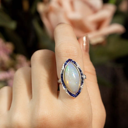 6.55ct Marquise Opal with Sapphire and Diamond Cluster Navette Ring