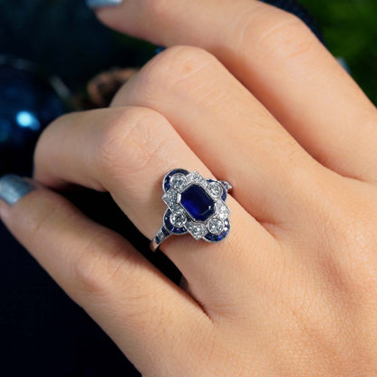 0.99ct Emerald Cut Ceylon Sapphire and Diamond Cluster Dress Ring in 18ct White Gold