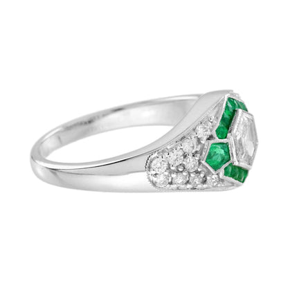 Hexagonal Diamond and Emerald Cluster Engagement Ring, 0.38ct hexagonal-cut diamond surrounded by calibre emerald hexagon border in 18ct white gold with diamond studded shoulders