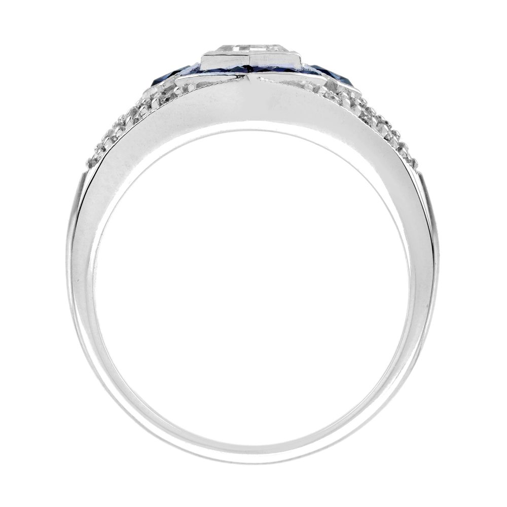 Unique Hexagonal Diamond and Sapphire Cluster Dress Ring, 0.45ct hexagonal-cut diamond surrounded by calibre French-cut sapphires on diamond-studded 18ct white gold mount